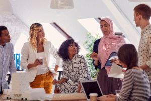Diverse engineering team collaborating in a modern office meeting room