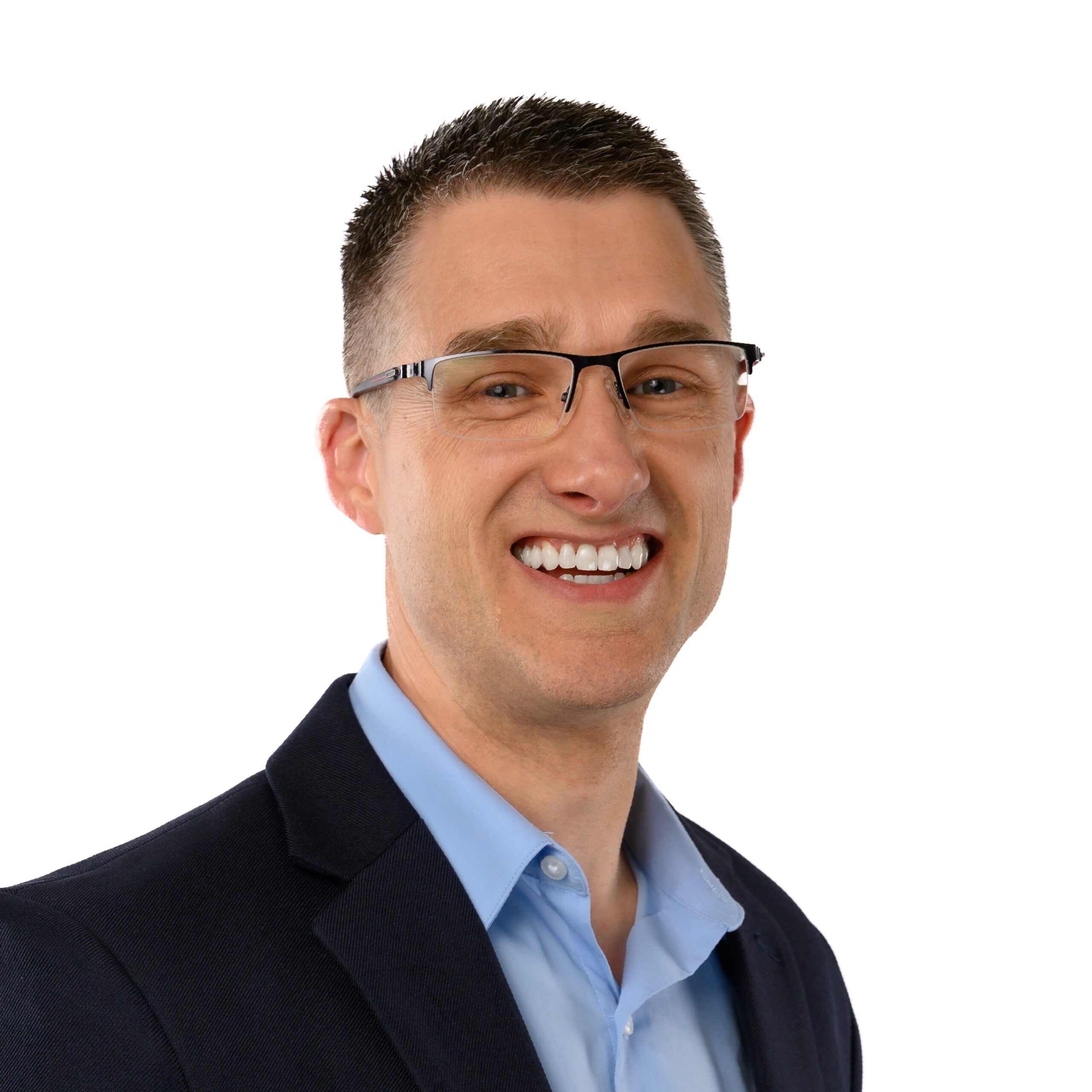 Leadership trainer Mark Erickson celebrating one year as a full‑time entrepreneur in a professional suit.